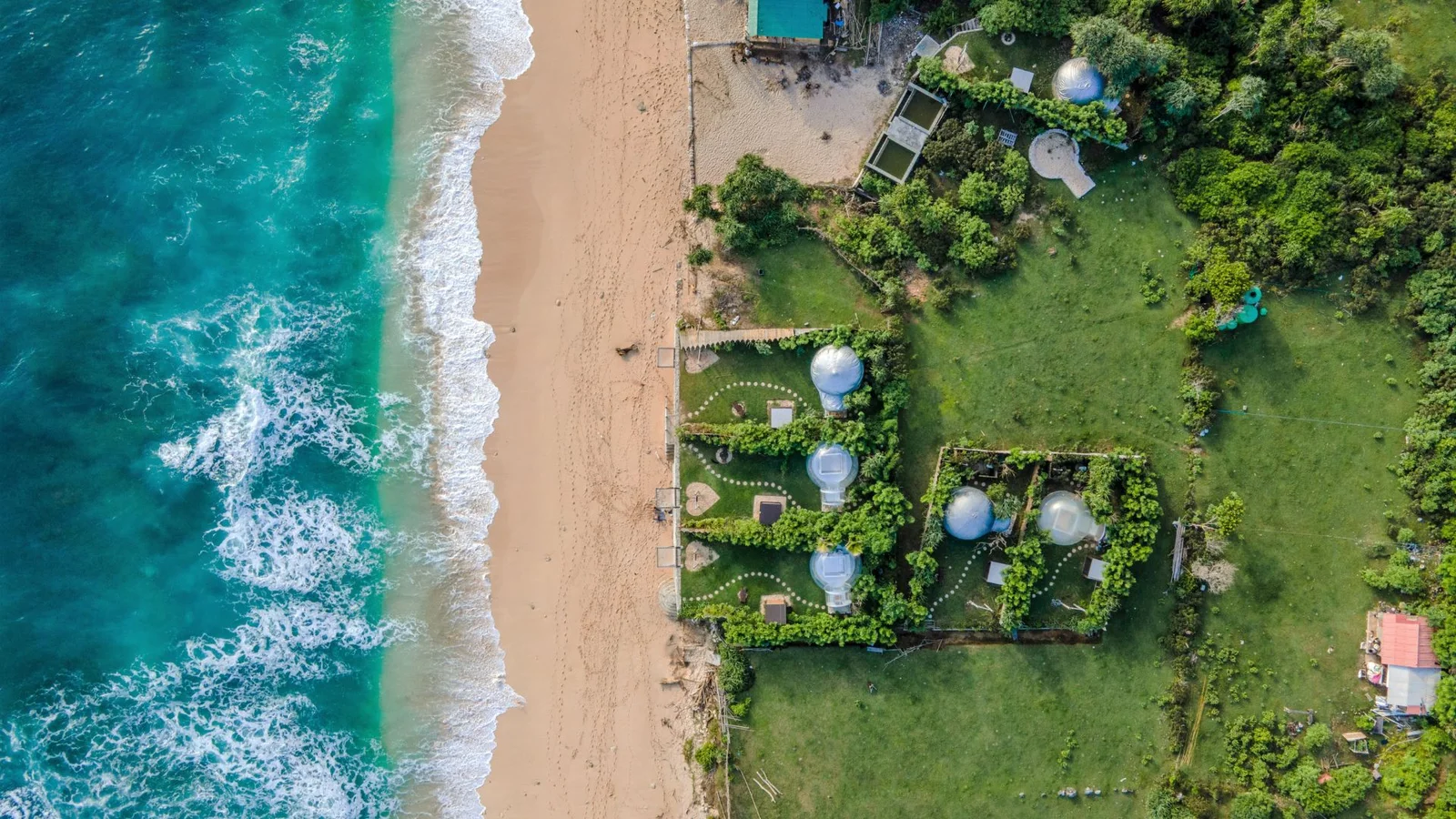 Aerial view of Bali coastline showcasing strategic areas for property investment Bali growth